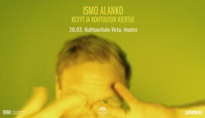 Vihreäkeltainen tausta, jossa näkyy ihmisen pää,hiukset ja kädet sumuisesti