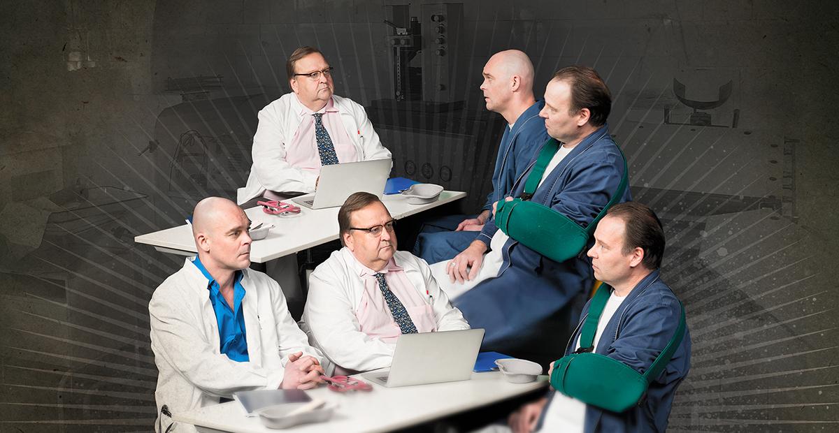 Esityksen mainos jossa päähahmot lääkäritakeissa